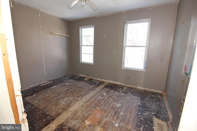 unfurnished room with hardwood / wood-style flooring and ceiling fan