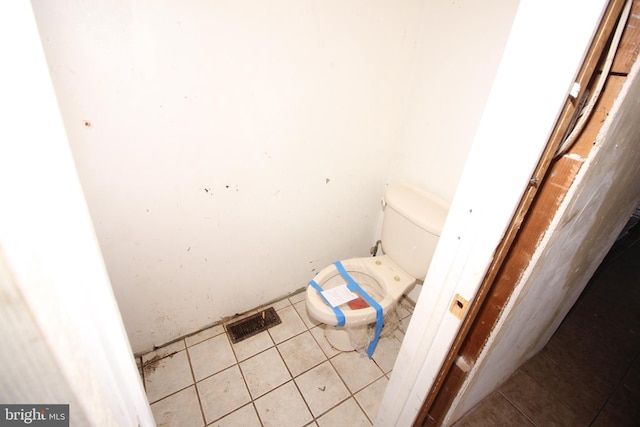 bathroom featuring tile patterned floors and toilet