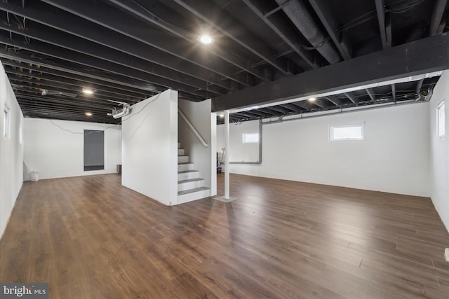 basement with dark wood-type flooring