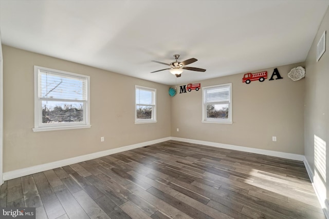 unfurnished room featuring dark hardwood / wood-style floors and ceiling fan