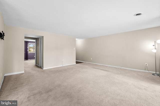 unfurnished room with light colored carpet