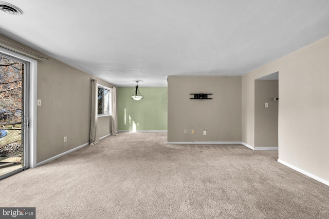 unfurnished room with carpet flooring