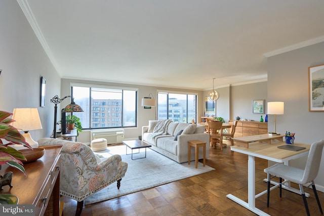 living room with crown molding, a wall unit AC, and a notable chandelier