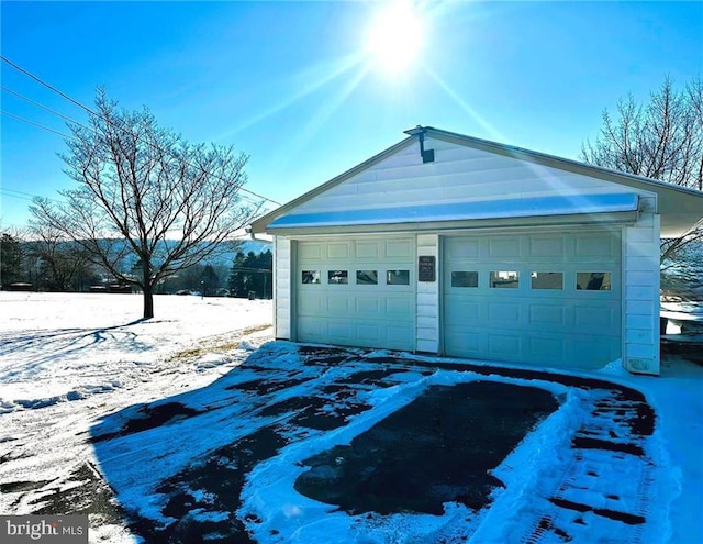 view of snow covered garage