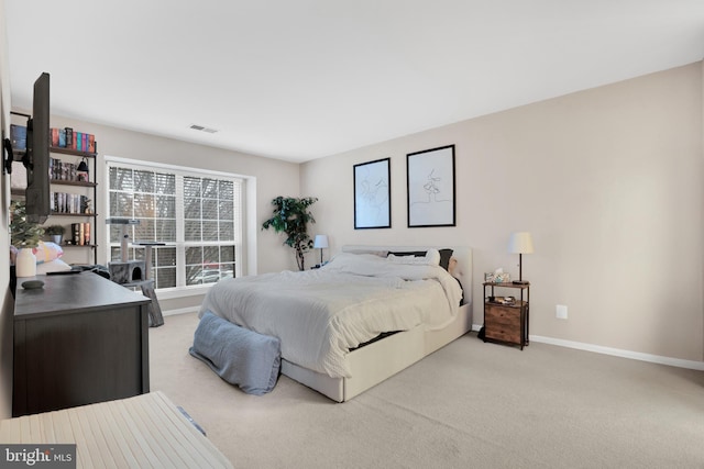 bedroom with light colored carpet