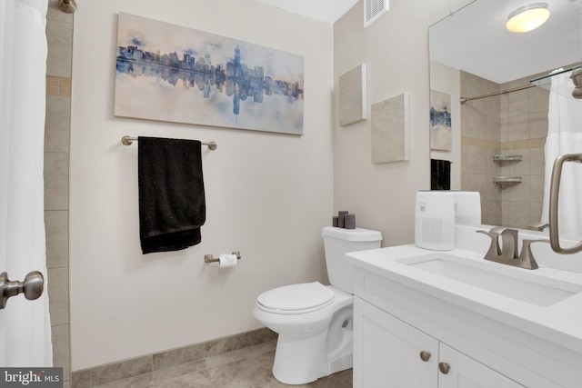 bathroom featuring vanity, toilet, and a shower with shower curtain