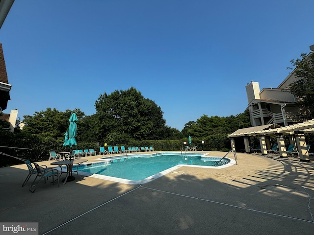 view of swimming pool featuring a patio area