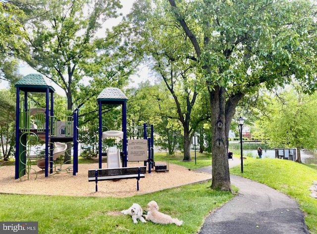 surrounding community with a playground and a yard