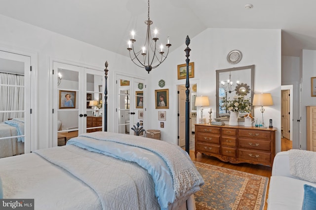 bedroom with hardwood / wood-style flooring, high vaulted ceiling, a notable chandelier, access to outside, and french doors