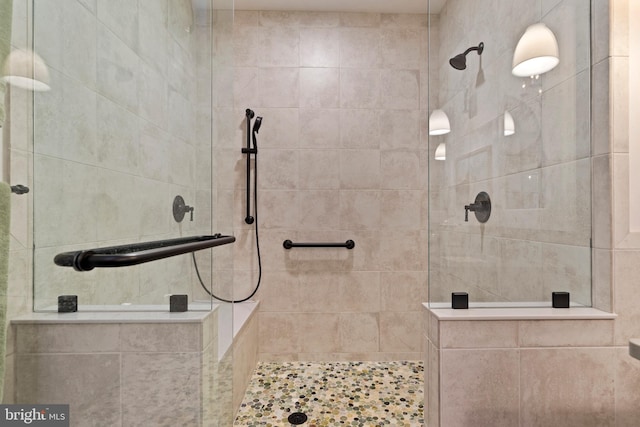 bathroom with tiled shower