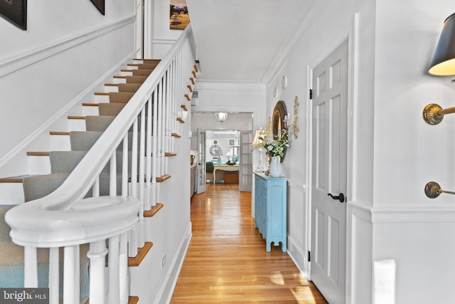 interior space featuring ornamental molding and hardwood / wood-style floors