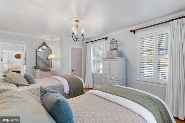 bedroom featuring crown molding and a chandelier