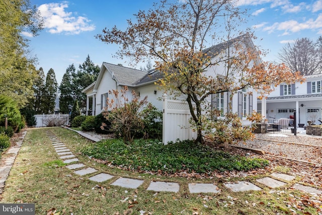 view of side of property featuring a garage