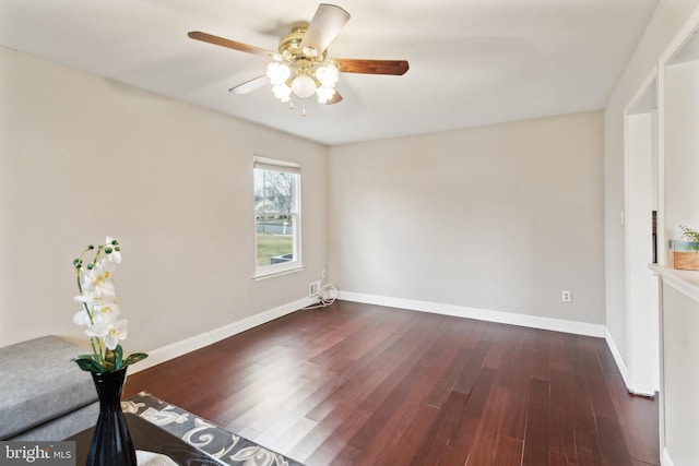 unfurnished room with dark wood-type flooring and ceiling fan