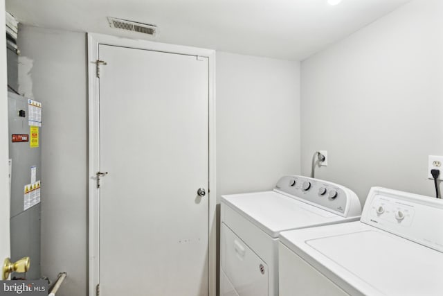 laundry area featuring independent washer and dryer and gas water heater