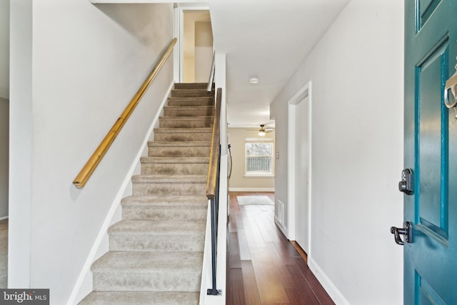 entrance foyer with dark wood-type flooring and ceiling fan