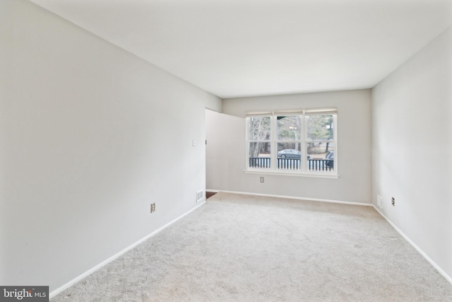 empty room with light colored carpet