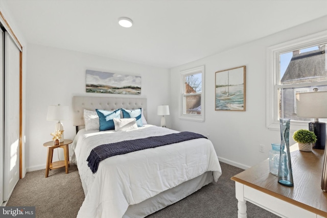 carpeted bedroom featuring a closet