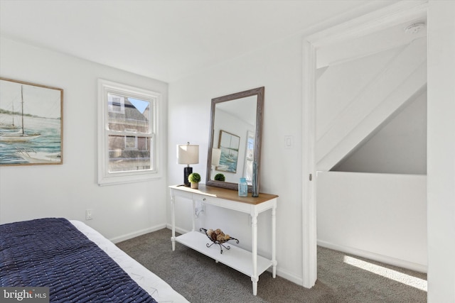 bedroom with dark carpet