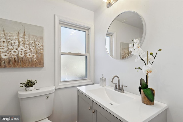 bathroom featuring vanity and toilet