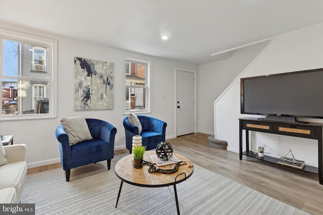 living room featuring light hardwood / wood-style floors and a wealth of natural light