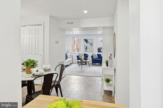 dining area with light hardwood / wood-style flooring