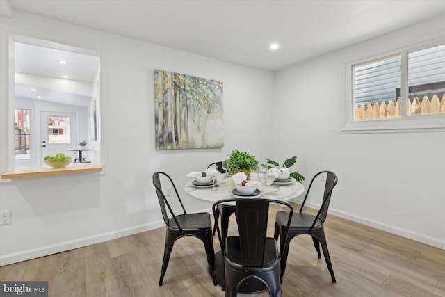 dining space featuring light hardwood / wood-style flooring