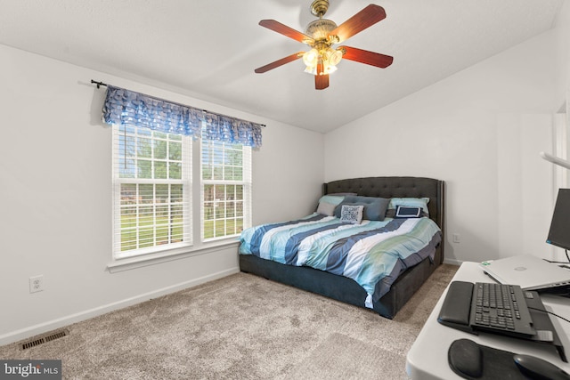 bedroom featuring ceiling fan and carpet