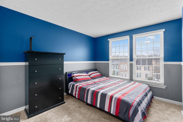 carpeted bedroom with a textured ceiling