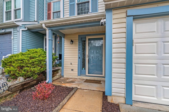 entrance to property featuring a garage