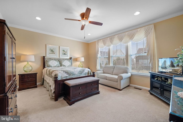 bedroom featuring light carpet, crown molding, and ceiling fan