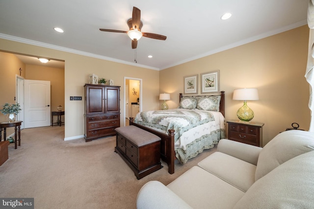 bedroom with ceiling fan, ornamental molding, connected bathroom, and light carpet