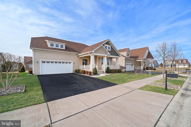 craftsman inspired home with a front lawn and a porch