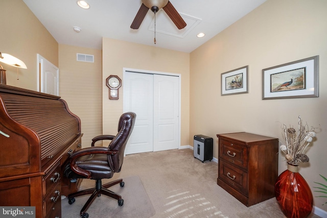 carpeted office featuring ceiling fan