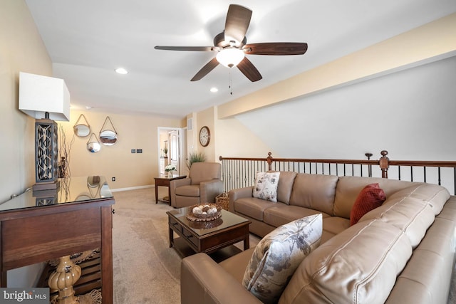 carpeted living room with ceiling fan