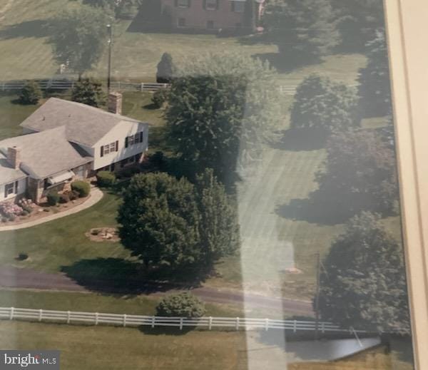 birds eye view of property with a rural view