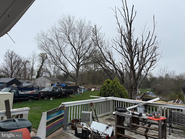 wooden deck with a yard
