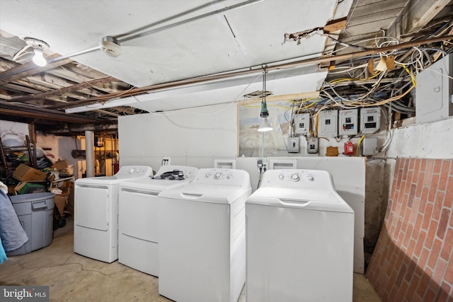 laundry room with washer and clothes dryer and electric panel