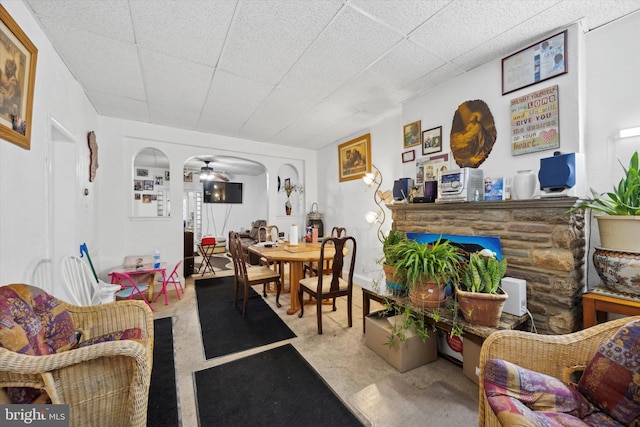 living room featuring light colored carpet and ceiling fan