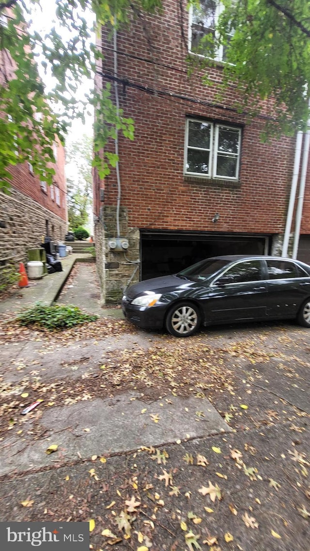 view of side of property with a garage