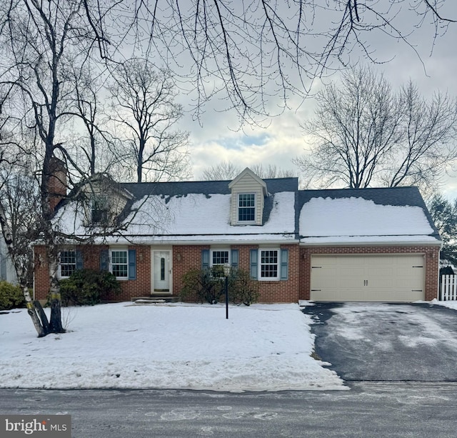 new england style home with a garage