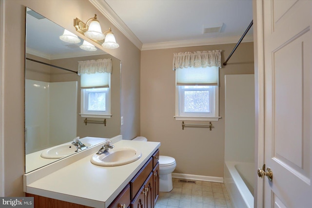 bathroom featuring ornamental molding, a healthy amount of sunlight, vanity, and toilet