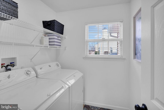 laundry room with washing machine and clothes dryer