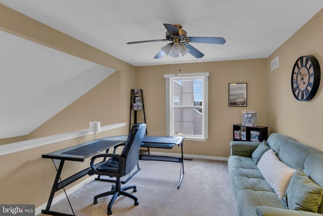 office space featuring light carpet and ceiling fan