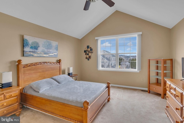 bedroom featuring ceiling fan, lofted ceiling, and light carpet