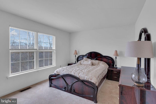 bedroom with light carpet