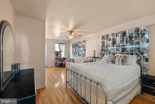 bedroom featuring light hardwood / wood-style flooring and ceiling fan