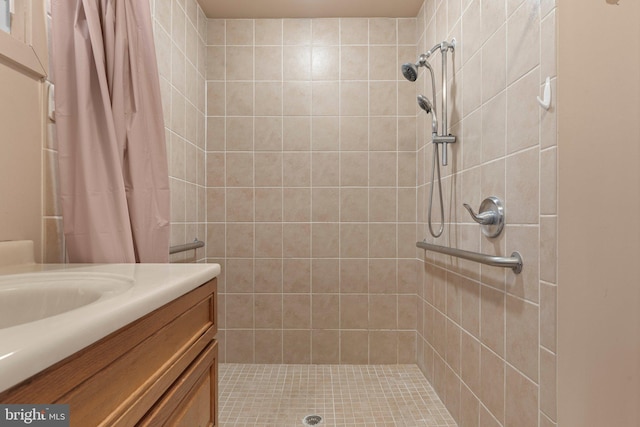 bathroom with vanity and a shower with shower curtain