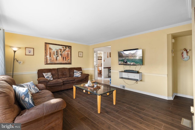 living room featuring ornamental molding and dark hardwood / wood-style floors