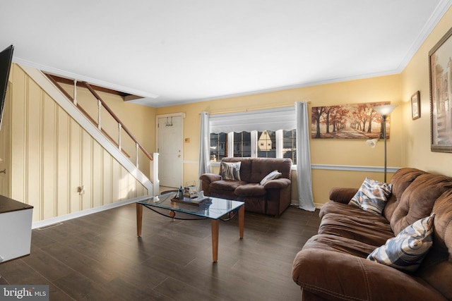 living room featuring ornamental molding and dark hardwood / wood-style floors